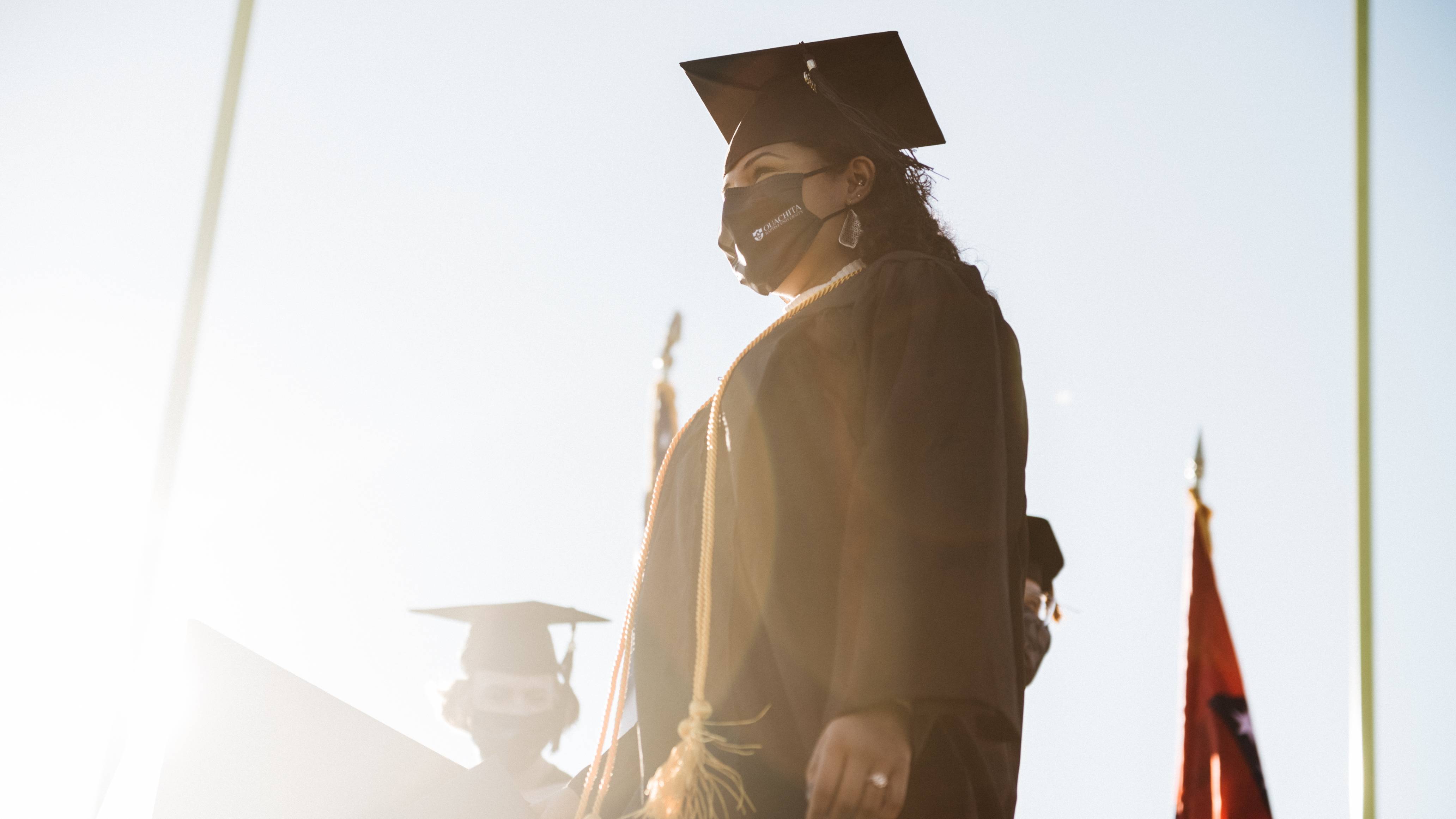 2020 graduate walks across stage to accept diploma