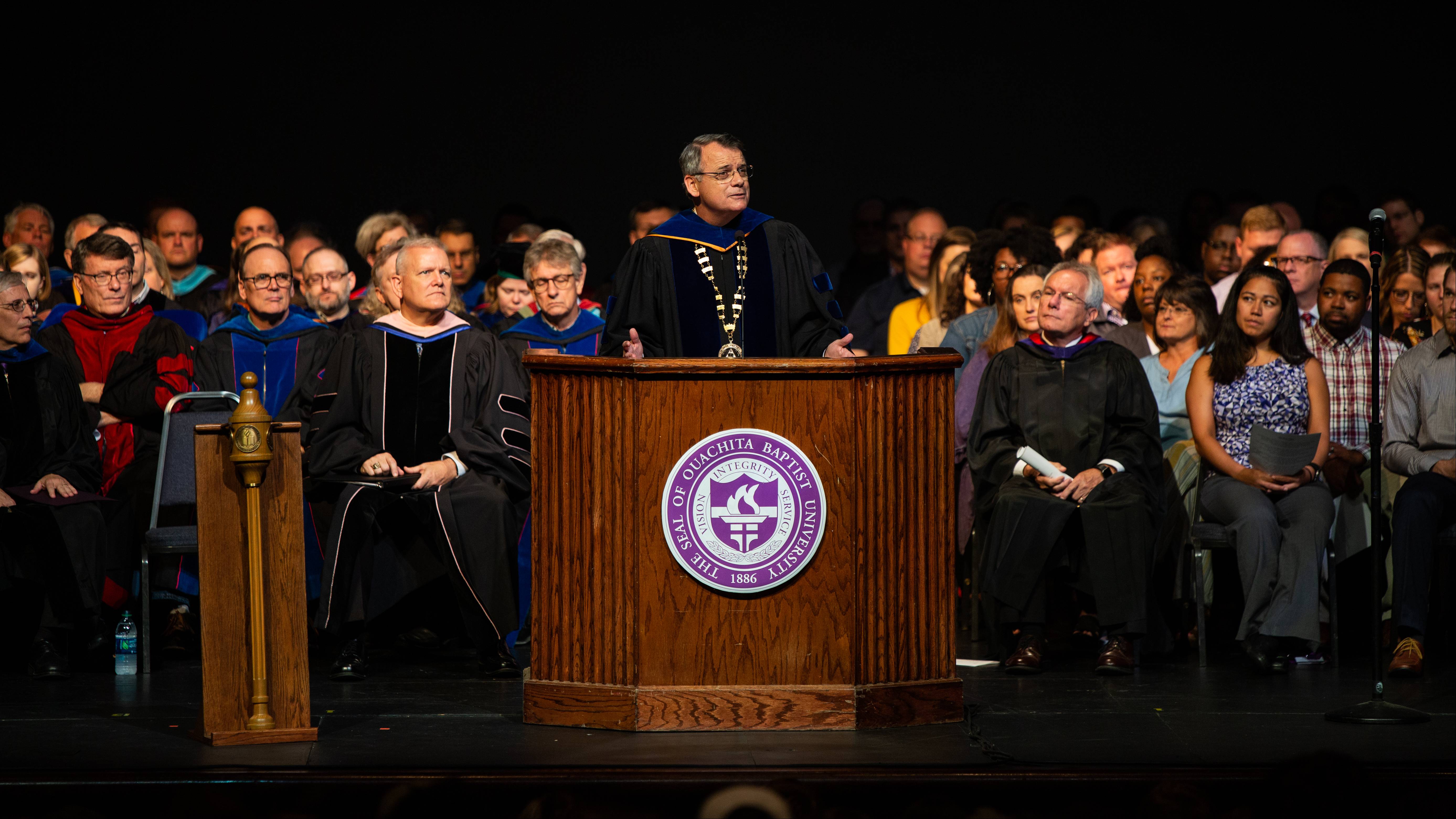 Ben Sells speaks on-stage during chapel